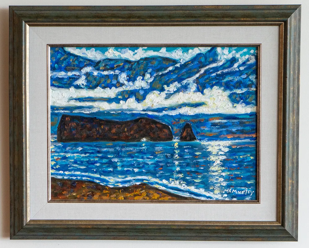 View of some rocks in a body of water.