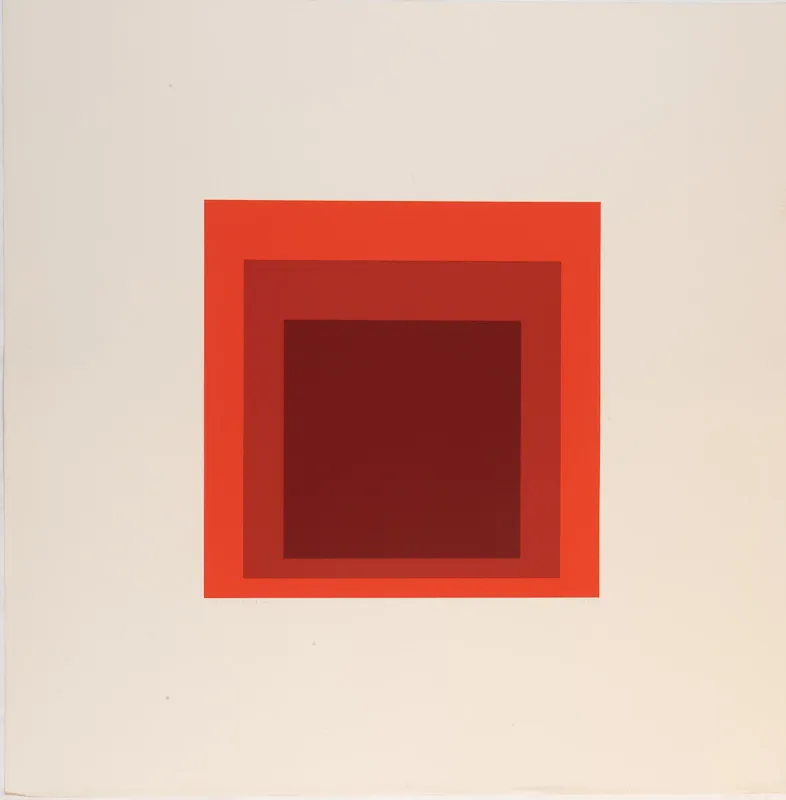 Three concentric squares in varying shades of red.