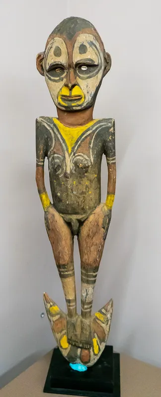 Stylized figure with yellow accents.