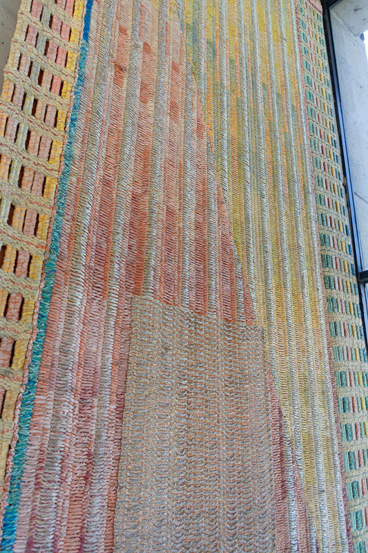 Large abstract tapestry hanging in situ.