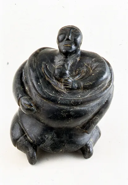 Woman Nursing Child