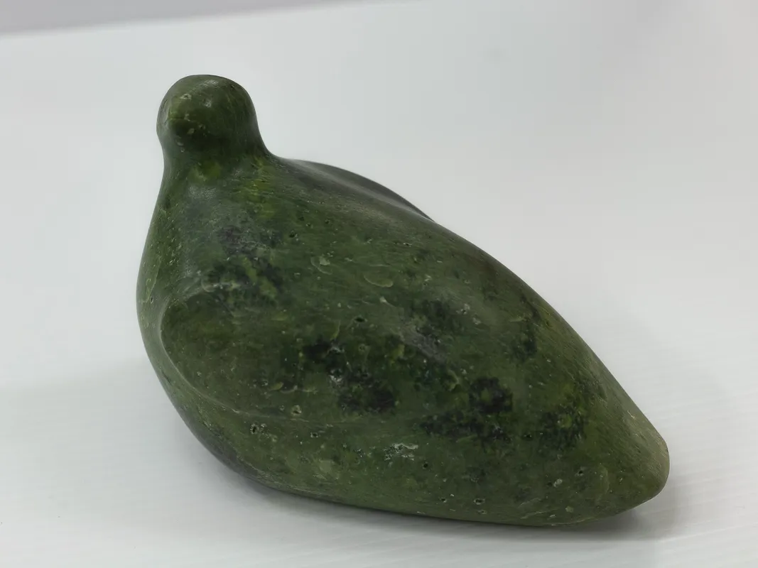 Carving of ptarmigan in green soapstone