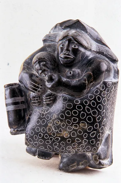 Woman Nursing Child