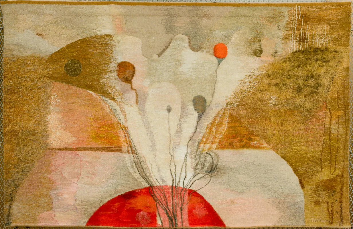 Still life of flowers on a red table. Overall, very orange/brown.