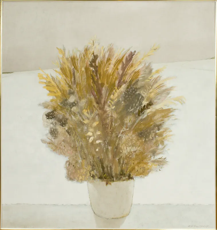 Still life of brown floral arrangement in a white vase.