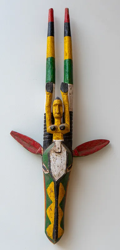 Giraffe-like animal with figure of a woman