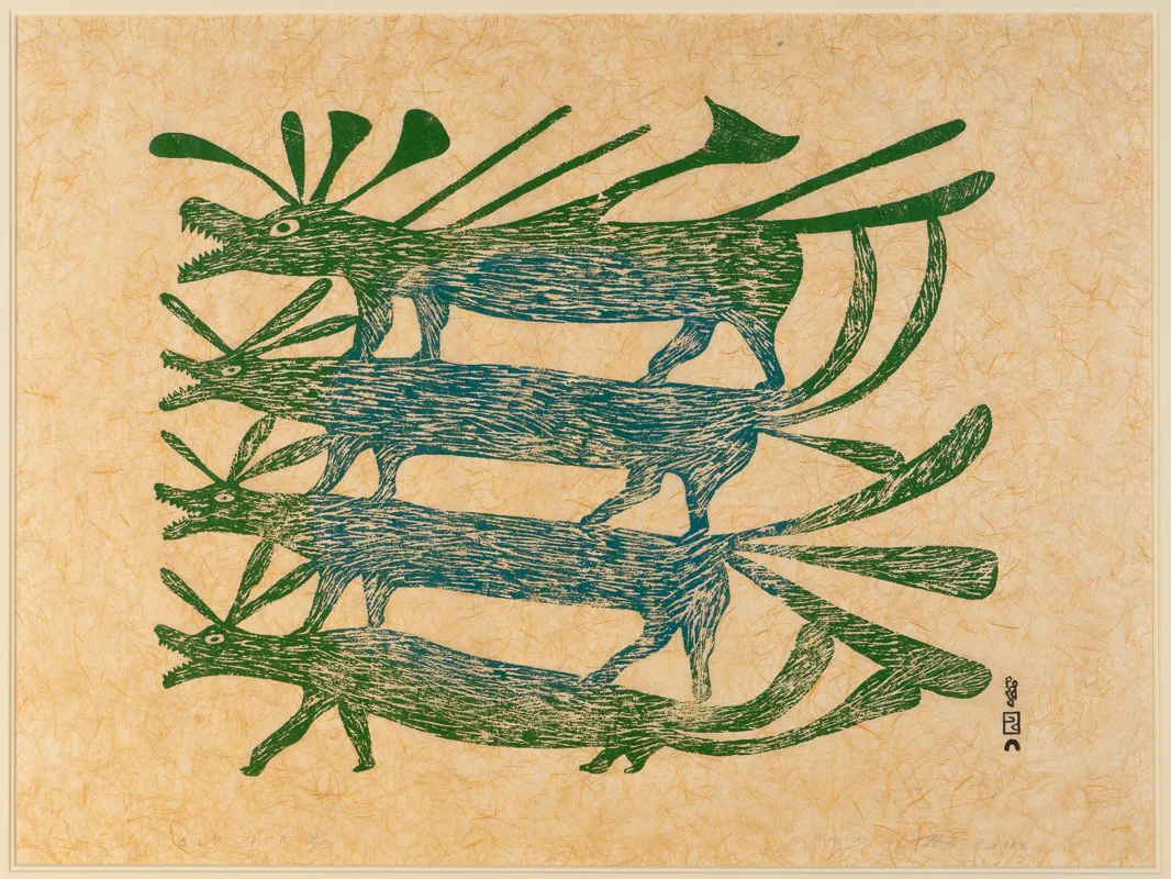 Four green dogs stacked on top of each other. 