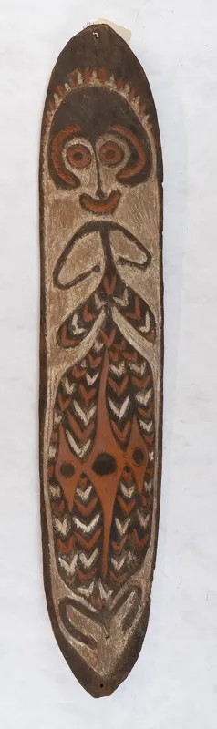 Tall skinny wooden board with stylized figure.