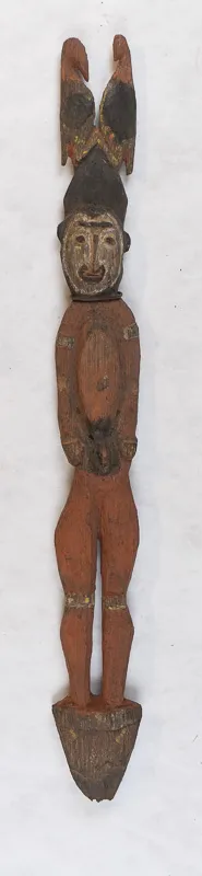 Carved stylized anthropomorphic figure with two birds on head. 