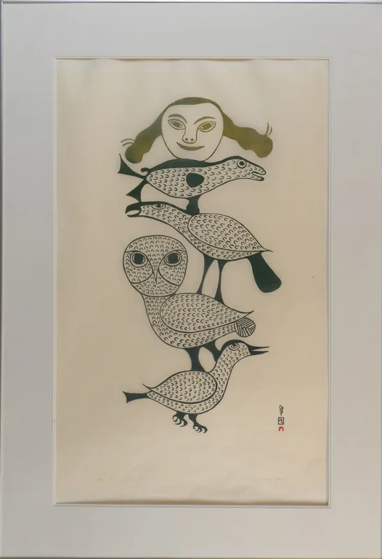 Four stacked birds with a woman's face on the top.