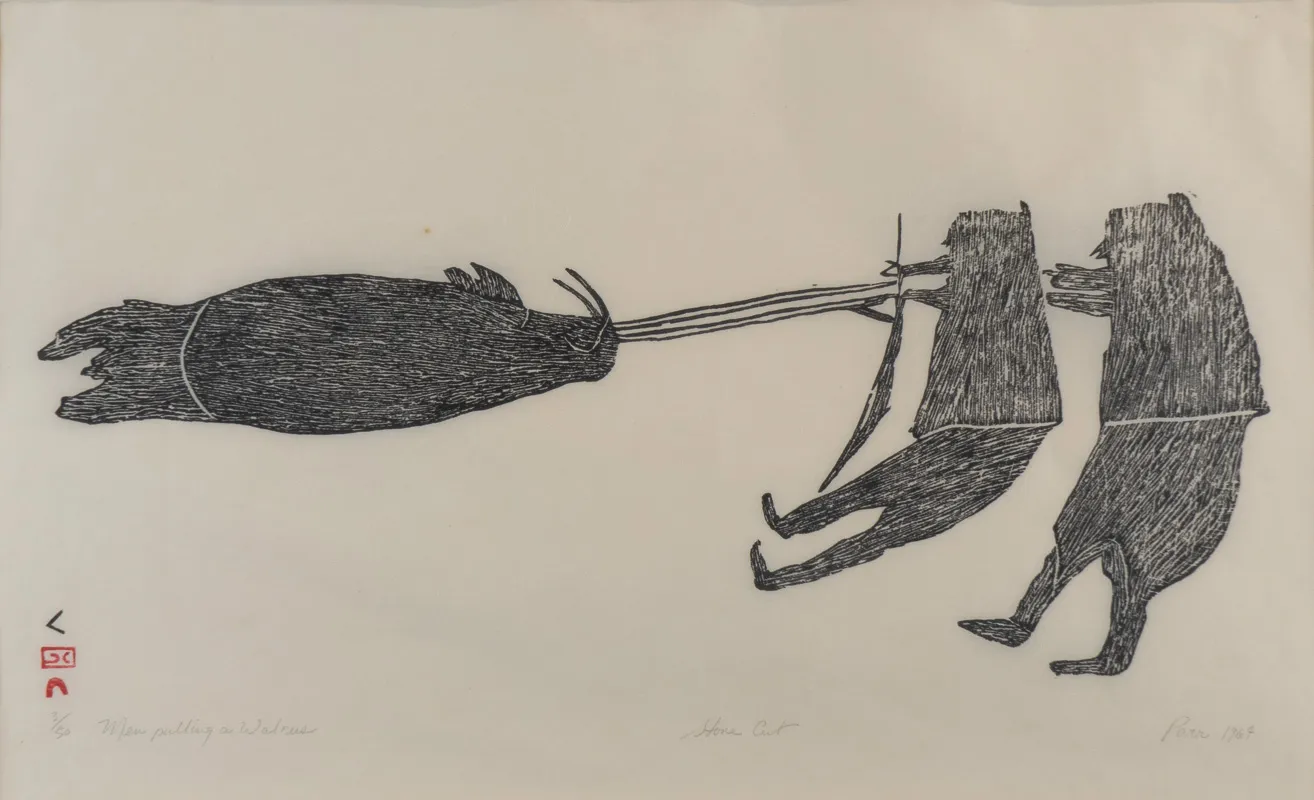 Two hunters pulling a large walrus.