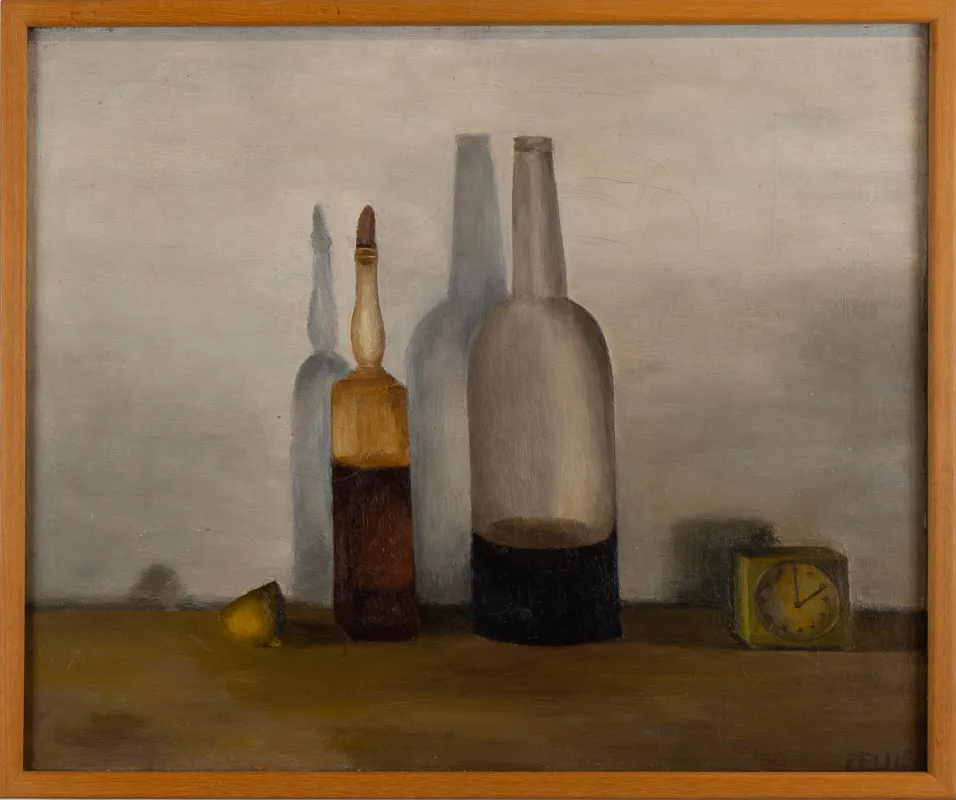 Bottles and cirtus fruits on a counter or shelf. 