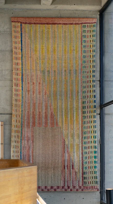 Large abstract tapestry hanging in situ.