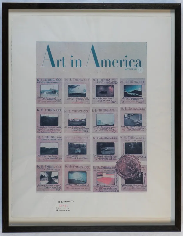 A print of the cover of Art in America showing a grid of 16 slides.