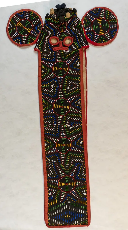 Stitched and beaded mask in the shape of a stylized elephant head.