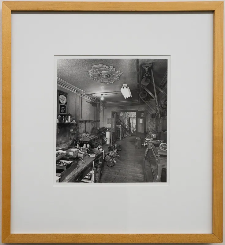 Interior of an ornate machine shop in black and white.