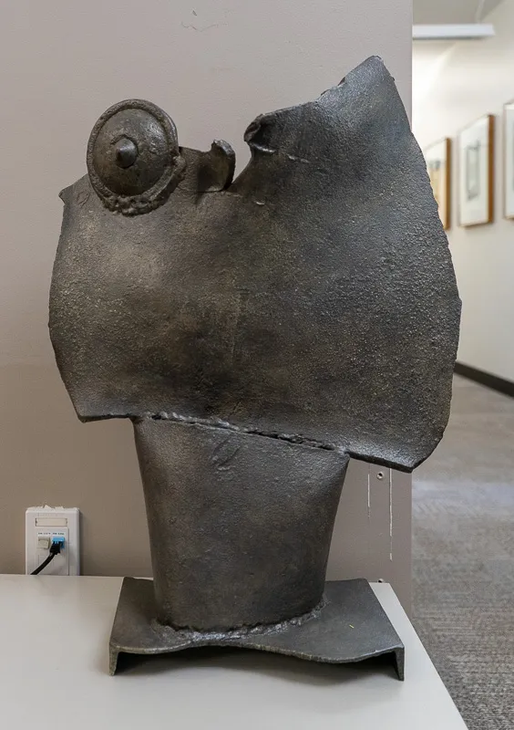 Welded steel structure that suggests a breastplate. 