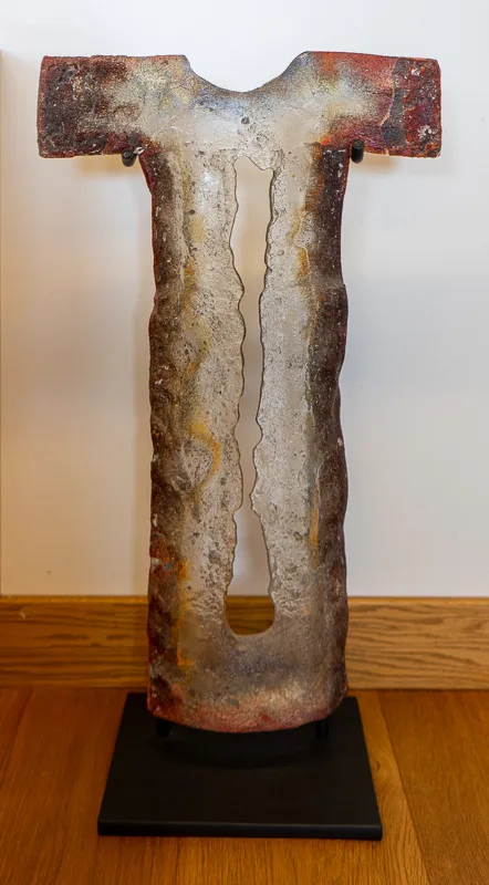 Welded dress or robe with a vertical slit up the front.