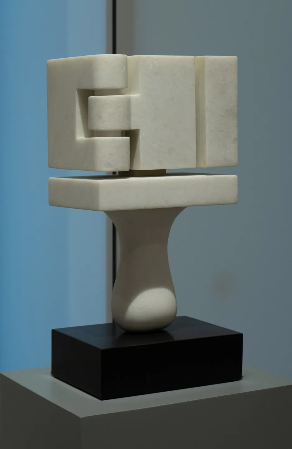 White stone on black stone base. Rectangular abstract form.