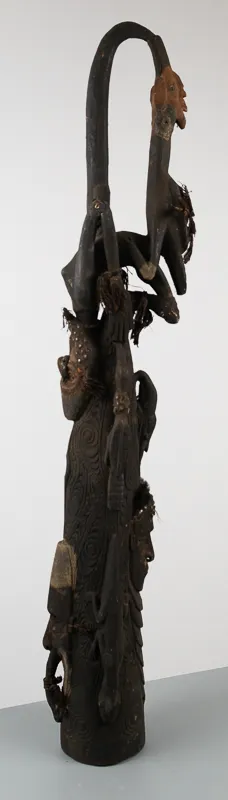 Ornate carved figures in dark wood.